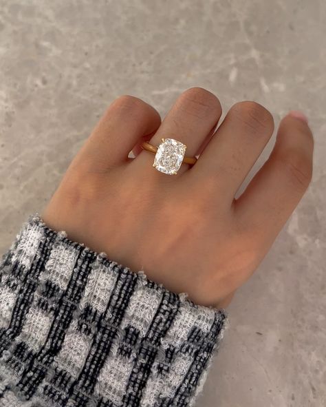 Heres a Micro Trend we noticed... or is it macro? 💍 📈 Elongated Cushion cuts! Whats the big deal? They have been spotted on A-listers like Kim Kardashian and Victoria Bekham but why not just wear a traditional cushion cut diamond, like Megan Markle did? We think they have gained recent popularity because they are the sweet middle spot between the gorgeous elongated shape of an oval cut (we all love) and the crushed ice brilliance of a radiant cut. The ratio that makes these so desirable... Crisscut Elongated Cushion, Elongated Cushion Cut Diamond Ring, Hidden Halo Cushion Cut Engagement Ring, Elongated Cushion Engagement Rings, Elongated Cushion Engagement Ring, Circle Engagement Rings, Cushion Solitaire Ring, Engagement Ring With Side Stones, Radiant Cut Diamond Ring