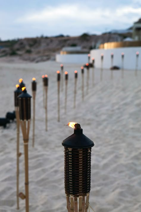 tiki torches for beach bbq Torch Aesthetic, Diy Wedding Benches, Tiki Aesthetic, St Lucia Beach, Fantasy Country, Belize Wedding, Party Gadgets, Beach Setting, Starting A Restaurant