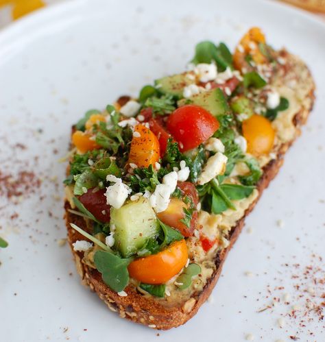 Mediterranean Hummus Toast with Za'atar is a savory, healthy want to start your day or a great afternoon pick-me-up. Hummus is spread on toast and topped with fresh tomatoes, cucumbers, herbs and feta and a sprinkling of za'atar. // acedarspoon.com #hummus #breakfast Hummus Breakfast Ideas, Breakfast Hummus, Hummus Breakfast, Mediterranean Hummus, Hummus Toast, Healthy Hummus, Mediterranean Diet Recipes Dinners, Za Atar, On Toast