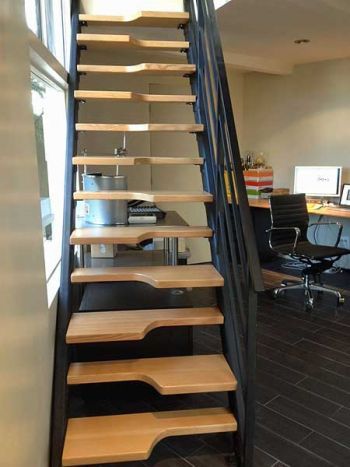 Steeply angled alternating stairs provided a space-saving solution to adding a second-floor room to this small space. (Photo courtesy of Ang... Alternating Stairs, Stair Below Space Design, Steep Stairs, Steep Stairs Solution, Single Flight Staircase Design, Loft Stairs Space Saving Staircases Metal, Folded Steel Staircase, Steep Staircase, Tiny Home Office