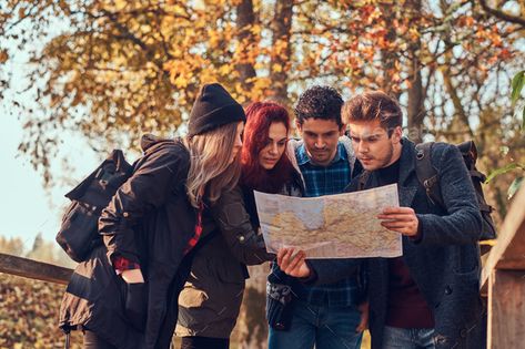 Group of young friends hiking in autumn colorful forest, looking at map and planning hike. by fxquadro. Travel, hiking, adventure concept. Group of young friends hiking in autumn colorful forest, looking at map and planni... #Sponsored #autumn, #colorful, #forest, #hiking Hiking Poses, Friends Hiking, Hiking Group, Jungle Hike, Forest Hiking, Hiking Summer, Colorful Forest, Group Poses, Hiking Adventure