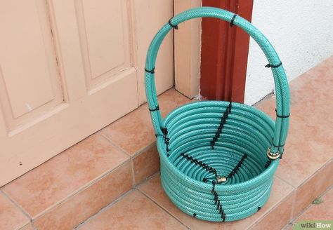 3 Ways to Make a Basket from a Garden Hose - wikiHow Diy House Warming Gift Ideas, Diy House Warming Gift, Basket Raffle, Auction Basket Ideas, Fundraiser Baskets, Auction Gift Basket Ideas, Old Garden Tools, Raffle Basket Ideas, House Warming Gift Ideas