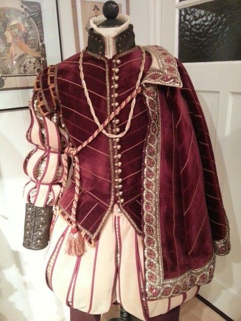 Elizabethan era style red mens doublet, ivory red striped pantaloons, and single shoulder draped cape, menswear costume: Mens Garb, 16th Century Fashion, Fest Outfits, Medieval Costume, Period Outfit, Century Clothing, Medieval Clothing, Historical Costume, Fantasy Clothing