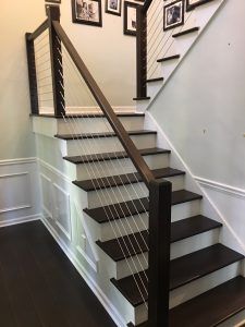 Wood Cable Railing Wood Stairs With Cable Railing, Modern Cable Railing, Wood And Metal Stair Railing Modern, Cable Handrails For Stairs, Cable Stair Railing Interior, Wire Railings For Stairs, Interior Cable Stair Railing Ideas, Cable Railing Stairs Interior, Cable Railing Interior Staircases