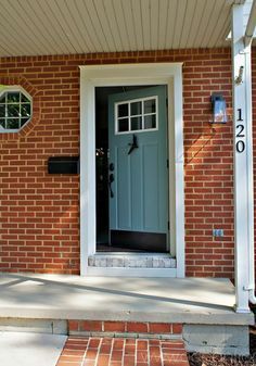 Adding trim around your door is a front door idea that gives your entryway true curb appeal, making it stand out more from the rest of the house. Brick House Front Door Colors, Orange Front Doors, Front Door Ideas, Black Front Door, Front Door Trim, Front Door Hardware, Brick Houses, Best Front Doors, Blue Front Door