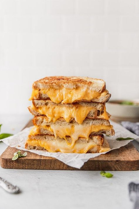 Indulge with this 4 Cheese Gourmet Garlic Grilled Cheese the next time you're craving comfort food! Easy to make and oh so delicious! Garlic butter and a parmesan crust across each slice of sourdough bread, with gooey provolone, gouda, and cheddar inside. Sandwich dream come true! | Fork in the Kitchen #forkinthekitchen #cheese #sandwich #grilledcheese Garlic Grilled Cheese, Southern Pimento Cheese, Grilled Cheese Recipes Gourmet, Burger Photography, Ultimate Grilled Cheese, Bagel Breakfast Sandwich, Gourmet Grilled Cheese, Classic Grilled Cheese, Grilled Cheese Sandwiches