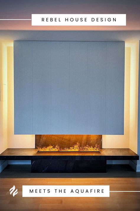 We love seeing the interior design magic our clients are able to dream up + implement with our fireplaces 😍 This Aquafire 60" looks dreamy against this backlit mantel and custom hood. No gas, no fumes, no vents, no difficult installation...just water + ambiance! Upgrade your fireplace to Aquafire's innovative electric water vapor fireplace this #holidayseason. www.aquafire.com Water Vapor Fireplace, Vapor Fireplace, Water Vapor, Electric Fireplace, Holiday Season, Fireplace, Electricity, Interior Design, Water