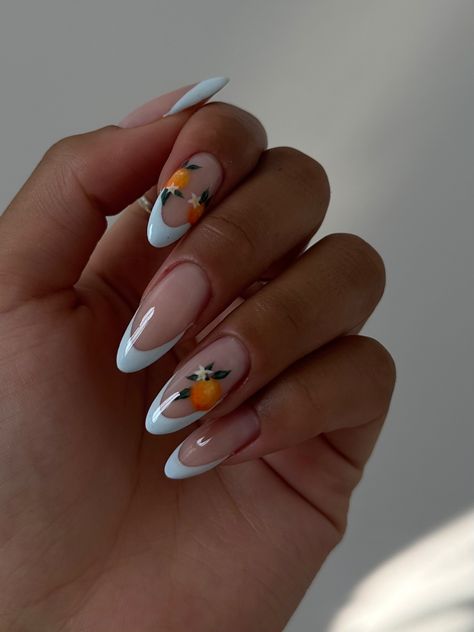 handpainted orange nails & blue french tips. Credit: @elixirnailstudio Summery Nails Blue, Italian Summer Nails Aesthetic, Summer Italy Nails, Nails With Oranges, Orange French Nails Almond, Spain Nails Ideas, Clase Azul Citrus Nails, Oranges On Nails, Malta Nails