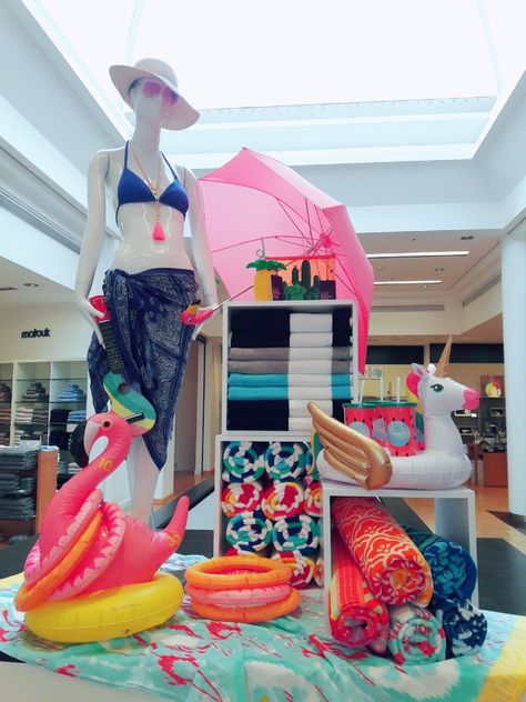 Swimwear meets fun and colorful beach towels and accessories in this pop up display Towel Shop Display, Beach Towel Display Retail, Beach Towel Display, Swimsuit Store Display, Beach Retail Display, Pool Store Display Ideas, Beach Visual Merchandising, Summer Displays Retail, Swimwear Store Display