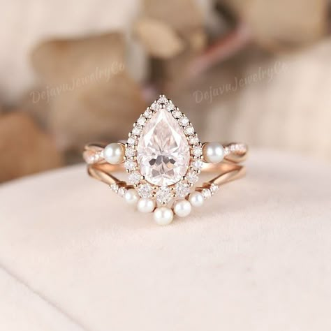 Delicate Moissanite Engagement Ring Set Pearl Cluster Wedding Ring Halo Moissanite Twisted Wedding Ring Rose Gold Pearl Curved Wedding Band ✦ Handmade, high-quality item ✦ Material: SOLID 14K/18K GOLD ( can be made in yellow/white/rose gold ) ✦Engagement ring ✦ Center stone: Moissanite ✦ Size/Weight: 6*9mm ✦ Color: DEF color ✦ Cut: Pear Shaped ✦ Side stones: Natural diamonds & Freshwater pearl ✦ Weight: About 0.331ct ✦ Color: G-H ✦ Clarity: SI-VS ✦ Or Side stones Moissanite & Freshwater pearl: 0 Pear Engagement Ring With Pearls, Diamond Pearl Engagement Ring, Vintage Engagement Rings Pearl, Diamond And Pearl Engagement Ring, Pearl Wedding Ring Set, Pearl Wedding Rings, Wedding Ring Pearl, Pearl Engagement Ring Set, Pearl Halo Ring