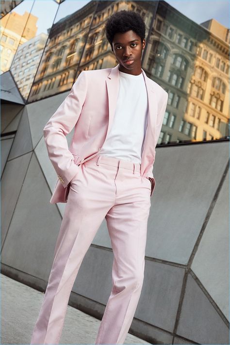 Model Alton Mason dons a pink suit from Express' latest lineup. Men Pink Suit Outfit, Man In Pink Suit, Suit Pink Men, Monochrome Suits Men, Pink Mens Outfit, Men Pink Formal Outfit, Pink Prom Suits For Men, Men Pink Suit, Pink Formal Outfit Men