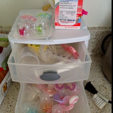 baby drawers for kitchen. pacifiers, med syringe, paci clips, ect. Baby Bottle Organization, Baby Drawer, Pacifier Storage, Drawer Cart, Baby Closet Dividers, Baby Room Organization, Fake Baby, Baby Storage, Paci Clip