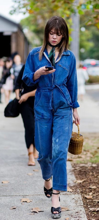 A Functional Jumpsuit Looks Feminine With Peep-Toe Wedges Denim Jumpsuit Street Style, Platform Outfit, Street Style 2016, Australia Fashion, Blue Jumpsuit, Trendy Swimwear, Denim Details, Fashion Week Street Style, Denim Jumpsuit