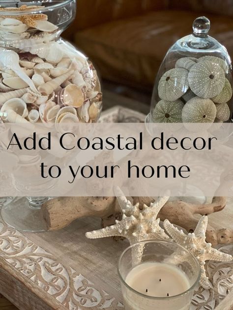 Coastal Coffee Table Decor, Coastal Mantle Decor, Beach Fireplace, Brown Leather Chesterfield Sofa, Round Coffee Table Decor, Coastal Coffee Table, Front Porch Decorating Ideas, Coffee Table Vignettes, Carved Tray