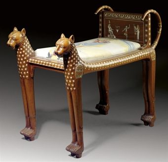 AN EGYPTIAN REVIVAL MOTHER OF PEARL-INLAID SOLID ROSEWOOD STOOL**  CIRCA 1900  Formed as two dogs flanking a slip seat and an inlaid back panel of ancient Egyptian scenes  26 in. (66 cm.) high, 15½ in. (38.5 cm.) wide, 35 in. (89 cm.) deep Ancient Egypt Furniture, Pharaonic Furniture, Egyptian Interior Design, Ancient Egyptian Furniture, Egyptian Chair, Egypt Furniture, Egyptian Interior, Ancient Furniture, Egyptian Furniture