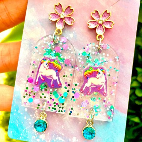 Lisa Frank Rainbow Unicorn Sticker Acrylic Earrings For Sale! These Earrings Are Absolutely Adorable. They Are Handmade By Me With Resin. Each Earring Has An Original Lisa Frank Sticker Embedded In It. They Are About 3 Inches Tall And Almost 1 Inch Wide. They Are From My Boutique, And Are Absolutely Cute And One Of A Kind! Lisa Frank Birthday Party, Pokemon Jewelry, Lisa Frank Stickers, Beautiful Beaded Jewelry, Chocolate Party, Unicorn Stickers, Lisa Frank, Cleveland Ohio, Rainbow Unicorn