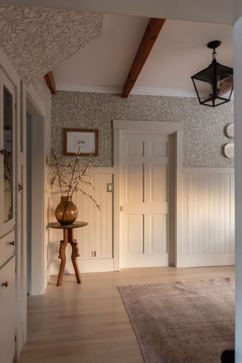 Paneling In Entry Way, Sage Green And White Hallway, Cottage Wall Paneling Ideas, Bedroom With Wallpaper And Paneling, Cream Panelling Hallway, Panelling And Wallpaper Living Room, Modern Cottage Hallway, Paneling In Hallway, Panel And Wallpaper Walls