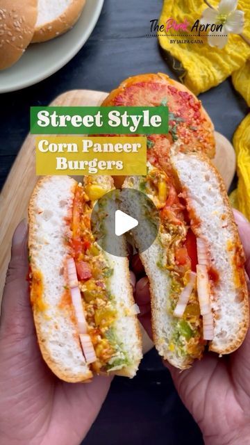 Jalpa Gada on Instagram: "STREET STYLE CORN PANEER BURGER 🍔   Crunchy, cheesy, and oh-so-satisfying – this Corn Paneer Burger is the epitome of street food perfection 👌🍔 …   INGREDIENTS  * Burger buns 2  * Green Chutney 2 tbsp * Butter 1/4 Cup * Coriander 2 tsp * Sliced tomatoes  * Grated Cheese 1/2 Cup  * Sliced onions  * Garlic Chilli chutney 2 tbsp * Tomato Ketchup 2 tbsp * Grated Paneer 1/2 cup * Boiled Corn 1/2 Cup * Chopped Bell peppers 1/2 Cup * Chopped Onions 1/4 cup * Chopped Garlic 1 tbsp * Schezwan Sauce 2 tbsp * Tomato ketchup 2 tbsp (in the filling) * Chilli flakes 2 tsp * Mixed herbs 2 tsp  * Salt to taste   Street food, burgers, vegetarian snack, Diwali snack, Diwali recipes, Jalpa Gada, the pink apron   #diwali #diwalirecipes #thepinkapron #appetizers #partysnacks #stree Paneer Burger, Paneer Without Onion And Garlic, Paneer Recipes Without Onion And Garlic, How To Make Paneer Sandwich, Paneer Cheese Corn Balls, Bread Snacks Recipe, Schezwan Sauce, Boiled Corn, Diwali Snacks