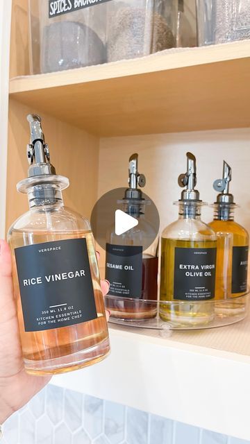 Kim | Organizing Expert on Instagram: "▪️Oil Decanters▪️Comment LINK & if you follow me you’ll automatically get a DM with the link. 🔗   Easily elevate your kitchen countertops (or cabinet in this case) with these oh so elegant & aesthetically pleasing decanters. Great for oils, vinegars & coffee syrup + they come with premade labels! Different colors options are available.   🚨Moving soon? Let us manage your next move! Declutter ➡️ Pack ➡️ Unpack ➡️ ORGANIZE! Message me to get started. You will NOT regret it!" Kitchen Pantry Design, Coffee Syrup, Pantry Design, Get Organized, Kitchen Pantry, Decanters, New You, Kitchen Essentials, Kitchen Countertops