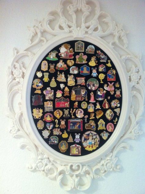 This is exactly what I want! A pretty cork board to display all of my Beauty and the Beast pins. If only I had this many...these are amazing! Thrifted Mirror, Disney Pin Display, Casa Disney, Haunted Mansion Wallpaper, Deco Disney, Disney Rooms, Disney Home Decor, Disney Decor, Disney Trading Pins