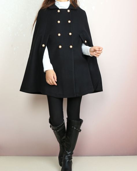 * A cool and long woolen cape coat, very elegant. * With gold color buttons and fully lined with lining. * Material: Outer-50% wool, 50% polyester; lining-100% polyester Shop sizing chart FYI ( actual body figures, not laying flat clothes measurements) Size XS (US 2, UK 6, German 32, French 34) Bust: fits bust around 33.5 inches/85cm Waist: fits waist around 26 inches/66cm Hips: fits hips around 36 inches/91cm Size S (US 6, UK 10, German 36, French 38) Bust: fits bust around 35.5 inches/90cm Wai Winter Cape Coat, Cloak Jacket, French Coat, Wool Cloak, Poncho Fashion, Wool Cape Coat, Long Coat Jacket, Concept Clothing, Ladies Poncho