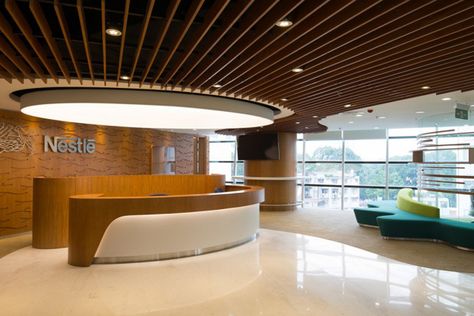 Nestlé office by ADP, Ho Chi Minh – Vietnam Reception Area Design, Curved Reception Desk, Office Reception Design, Reception Desk Office, Reception Desk Design, Office Lobby, Hospital Interior, City Office, Hospital Interior Design