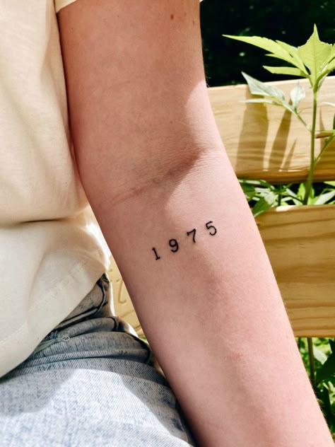 #1975 #the1975 #1975tattoo #tattoos #tattoosforwomen #armtattoo #womansleevetattoo #minimalisttattoos #hipstertattoos #yeartattoo #aesthetictattoos 1998 Small Tattoo, 1975 Number Tattoo, 1968 Tattoo Font, Somebody Else The 1975 Tattoo, Tattoo Ideas Female Birth Year, 1983 Tattoo Ideas, 1965 Tattoo Number, Year Tattoo On Arm, 1973 Tattoo Ideas