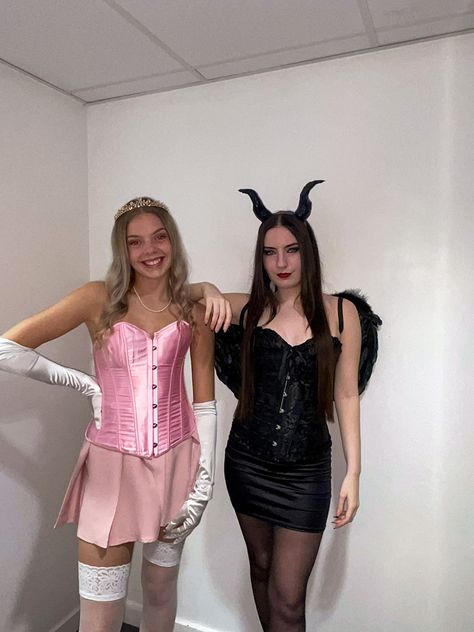 Corset Duo Halloween Costumes, Halloween Costumes Duo Blonde, The Blonde And The Brunette Duo, Black And Pink Halloween Costumes, Maleficent And Aurora Costume Duo, Blonde And Black Hair Costumes, Pink Character Costumes, Princess Aurora And Maleficent Costume, Halloween Costumes With Pink Skirt