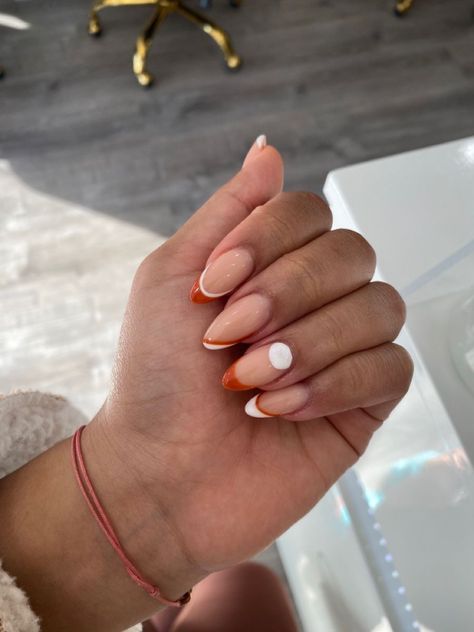 almond shape acrylics. Orange and white White And Burnt Orange Nails, White French Tip With Orange Line, Orange Tip Nails Almond, White Orange Nails, Almond Shape Acrylics, Orange White Nails, Orange And White Nails, Colored French Nails, Red Orange Nails