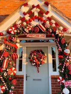 Candy Cane Theme Decorations Outdoor, Candy Cane Entryway, Candy Cane Door Garland, Candy Cane Outside Decorations, Outdoor Christmas Arch Ideas, Candy Cane Christmas Outdoor Decorations, Peppermint Porch Decor, Candy Cane Christmas Decorations Outdoor Front Porches, Christmas Porch Archway