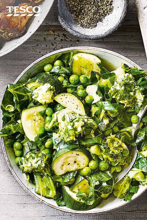 Make eating your greens interesting with this citrussy steamed greens medley. Steam spring greens, sweet peas and courgettes so they keep their vibrant colour, then melt through a herby citrus butter for a finishing flourish. | Tesco Green Vegetable Recipes, Citrus Butter, Brain Healthy Foods, Tesco Real Food, Steamed Vegetables, Tasty Vegetarian Recipes, Sweet Peas, Vegetable Sides, Greens Recipe