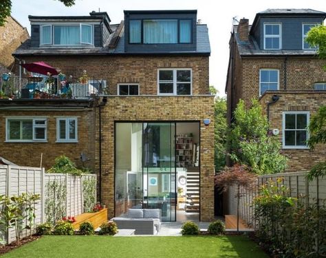 Large double height glass doors to the rear of this house renovation. The doors have a slim 21mm sightline and stand at 21mm. Even at this size they are still manually operated with a smooth sliding action. Stair Gallery, Glass Balcony, London Townhouse, Three Bedroom House, House Extension Design, Rear Extension, Victorian Terrace, Kitchen Extension, Loft Conversion