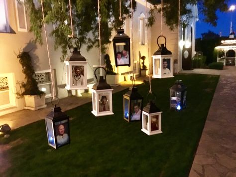 Memorial lanterns hanging in the tree for wedding reception in cocktail area. Memorial Area At Wedding, Remembrance Tree At Wedding, Honoring Loved Ones At Wedding Tree, Memorial Tree Ideas, Lanterns Hanging From Trees Wedding, Remembrance Lantern, Wedding Memorial Lantern, Diy Memorial Lantern With Photo, Candle Lighting Ceremony