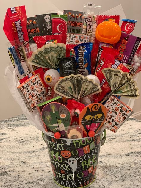 Candy, small toys and stickers bouquet. The basket makes a great gift for Halloween, Birthday, get well , thank you, teacher and/ or any other occasion. Items , themes and price may vary for special requests. **PLEASE NOTE - Contents may contain nuts or may be produced near nut products.* Small Basket Ideas, Money And Candy Bouquet, Toy Centerpieces, 21st Birthday Basket For Guys, Goodie Basket Ideas, Gift Basket Decorating Ideas, Halloween Baskets For Adults, Cute Birthday Baskets, Small Candy Bouquet