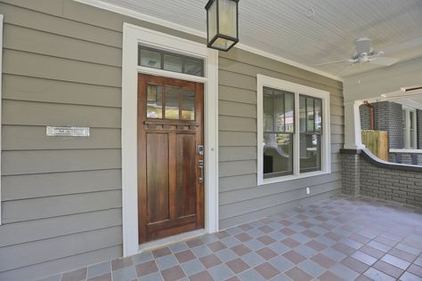 We love this front door style (without the transom) and we like the 3 top grilles, no lower grilles for the windows (we are also considering no grilles if there is a cost impact). Transom Above Front Door, Front Door With Transom Above, Window Above Front Door, Front Door Transom, Front Door With Transom, Fromt Doors, Door With Transom, Door Update, Beach House Plan