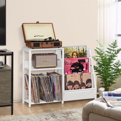 [Large Capacity Storage] The retro 3 tiers record player stand can store and organize up to 150 vinyl records, the spacious desktop can accommodate record players of various size. Moreover, the 2nd tier and the bottom space with detachable U-shaped dividers can also be used to put in media essentials such as albums, speakers and so on, meet your different storage needs. Color: White | Latitude Run® Audio Rack Wood / Manufactured Wood in White | Wayfair Cute Record Storage, Table For Vinyl Player, Record Area Living Room, Apartment Music Room, Record Storage Aesthetic, Vinyl Record Player Setup, Record Player Bookshelf, Record Stand Ideas, Record Player Nook