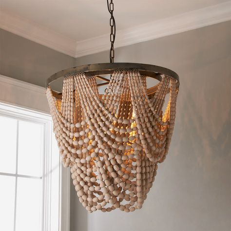 Check out Beaded Drape Curl Chandelier from Shades of Light Whether hung in a bedroom or over a dining table, our Beaded Drape Curl Chandelier will enrich your home's global aura. The bohemian-glam inspired look features whitewashed wood beads draped from 2 rustic gold, round metal frames that surround a 3 light cluster. • Actual Size: 26.5"Hx25.5"Wx25.5"D Rope Lamps, Rustic Remodel, Chandelier Lamp Shades, Chandelier Rustic, Bead Chandelier, Wood Bead Chandelier, Farmhouse Chandeliers, Lampshade Chandelier, Diy Chandelier