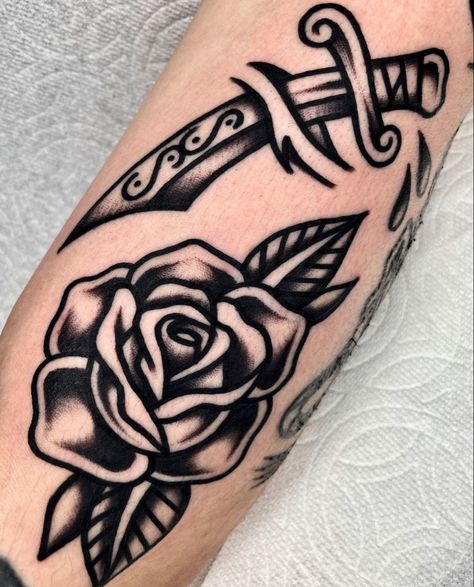 by sunhan.tattoo on insta <3 Name In Rose Tattoo, Lily Traditional Tattoo, American Traditional Black And White, Old School Flower Tattoo, Trad Rose, Traditional Heart Tattoo, Black And Grey Rose Tattoo, Rose And Dagger Tattoo, Traditional Rose Tattoo