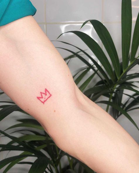 Red little crown tattoo by Loz Thomas inked on the left arm Red Crown Tattoo, Little Crown Tattoo, Basquiat Tattoo, Simple Crown Tattoo, Basquiat Crown, Small Crown Tattoo, Small Symbol Tattoos, Stick Tattoo, Red Dragon Tattoo