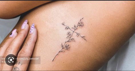 Flower Cross Rib Tattoo, Hope Flower Tattoo, Cross Made Of Flowers Tattoo, Western Minimalist Tattoo, Small Cross With Flowers Tattoo, Cross On Ribs Tattoo, Minimalist Cross Tattoo, Minimalist Tattoo Christian, Feminine Cross Tattoos For Women