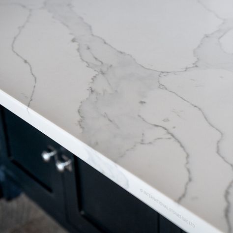 Calacatta Select quartz kitchen worktops
A beautiful and natural-looking quartz worktop bright white background, a solid light grey vein that’s enhanced with an outlined darker grey tone. Very popular with our customers and a trending style for 2020.

With its sleek style, this classic quartz colour is whiter than most natural marbles. The pronounced veining adds to its value for a dramatic effect, giving any kitchen a luxurious feel. No matter the style of your kitchen White Quartz With Grey Veining, Grey Quartz Countertop, Quartz Worktop, Kitchen 2023, Light Grey Kitchens, Grey Quartz, Bright White Background, Gray And White Kitchen, Quartz Kitchen Countertops