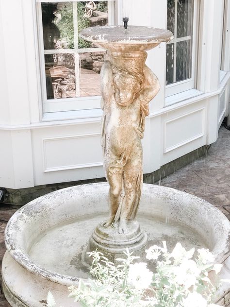 We love our Cherub garden fountain from @orlandistatuary. It’s made from a fiberglass material that mirrors the look of cement, but at a fraction of the weight. This fountain from #orlandistatuary which happens to be one of our favorite resources for outdoor statuary, urns, birdbaths, and decor. #frenchcountrydecor #gardens #patio #patioideas #waterfountain #fountain #outdoorliving #frenchstyle Vintage Fountain Garden, Victorian Fountain, Bubbler Fountains, Cherub Fountain, French Patio, Ivory Lane, Famous Fountains, Diy Fountain, Garden Fountain