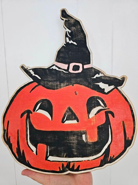 This hand painted wooden Jack-o-lantern is a unique sign that will add a spooky & festive touch to your Halloween decor. Measures approximately: 7" tall x 5" wide x .25" deep. Great for sitting on a mantel or shelf! Great gift idea for a friend or family also. Comes neatly and artistically packaged for an amazing delivery experience. Thank you for stopping by and taking a look around! To get a heads up on discount promotions and giveaways follow us at  https://www.instagram.com/oldsoulgypsyco/ And... https://m.facebook.com/oldsoulgypsyco/ Jack O Lantern Decor, Vintage Halloween Frankenstein, Halloween Decor Vintage, Vintage Halloween Pumpkin Faces, Vintage Halloween Jack O Lantern, Vintage Witch Halloween Decor, 1980s Halloween Decorations, Vintage Halloween Signs, Happy Halloween Signs Diy