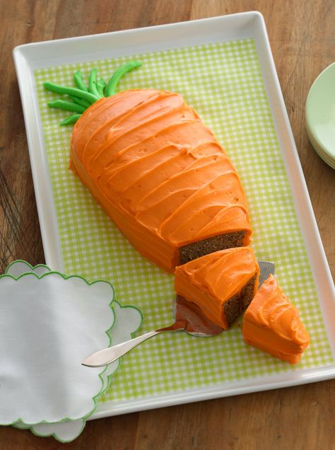 Take this carrot cake a step further by garnishing with chocolate cookie crumbs to resemble dirt! Carrot Cake Shaped Like A Carrot, Carrot Cake Decoration, Carrot Cakes, Orange Frosting, Shaped Cake, Cake Shapes, Carrot Cake Recipe, Cookie Crumbs, Baking Cupcakes