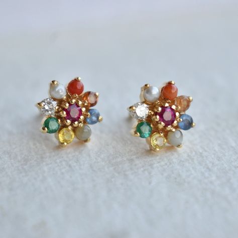 Kalyan Jewellers offers pure and high-quality navaratna earrings in gold. Explore the astro jewellery collections from the most trusted jewellers. Navratna Earrings Gold, Navarathan Earrings, Navarathna Ear Rings, Astrology Mythology, Navratna Earrings, Navratna Jewellery, Gold Earrings Indian, Antique Gold Earrings, Ruby Earrings Studs