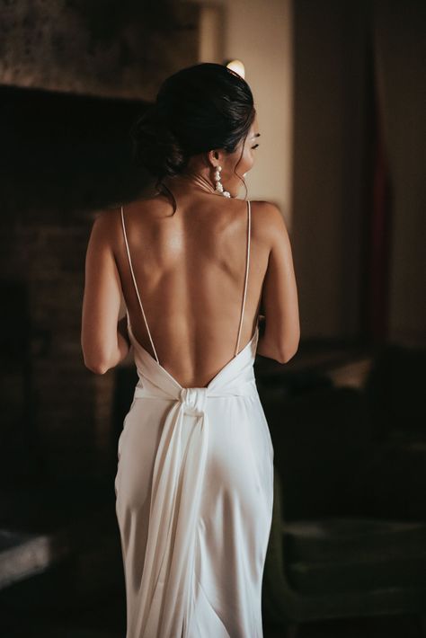 A Tuscan Villa Garden Wedding That Was Timeless In Its Simple Details #weddingdress #sexyweddingdress #backlessweddingdress Tie Up Back Wedding Dress, Stunning Simple Wedding Dress, Chic Minimal Wedding Dress, Wedding Dress Simple Backless, Low Back Bridal Gown, Beach Chic Wedding Dress, Backless Wedding Reception Dress, Wedding Dresses With Back Out, Low Back Beach Wedding Dress