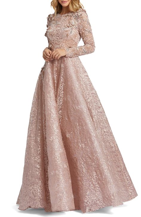 Plucked straight from a fairy tale, this glamorous gown features stunning floral mesh with 3D elements and shimmering beads across the bodice and sleeves. 62 1/2" length Jewel neck Long sleeves Partially lined 100% polyester Spot clean Imported Asian Owned/Founded Long Sleeve Lace Gown, Mesh Gown, Mac Duggal Dresses, Sleeveless Gown, Long Sleeve Gown, Inspiration Instagram, Lace Long Sleeve, Chiffon Gown, Mac Duggal