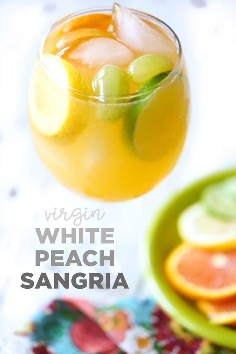 Perfect for summer parties, brunches, Mother's Day, or just a girls' night in, this Virgin White Peach Sangria is your perfect warm-weather party drink! #OurBestBites #Mocktail #Sangria #SangriaRecipes #PartyDrink #babyshower #nonalcoholic #drinks #brunch Detox Night Drink, Mocktail Sangria, Drink Mocktail, Weather Party, White Peach Sangria, Nonalcoholic Drinks, Virgin Drinks, Our Best Bites, Refreshing Beverages