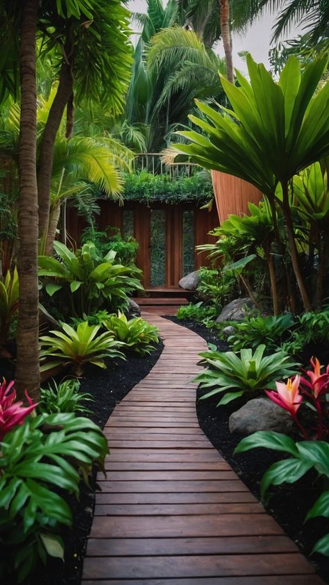 Discover inspiring small tropical gardens ideas for your backyard Get creative design landscaping ideas for small UK patios side yards Australian front yards and beds Find ideas for full sun plants in NZ with beautiful tropical landscaping concepts Tropical Entryway Landscaping, Tropical Verandah Ideas, Australian Tropical Garden Ideas, Pathway Designs Landscape, Full Sun Tropical Garden, Florida Gardens Landscaping, Tropical Front Garden, Tropical Garden Design Small Spaces, Subtropical Landscaping