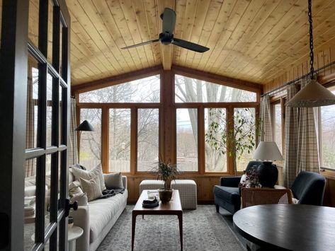 Updated, unpainted knotty pine porch with modern furniture and decor Sima Spaces Porch Renovation Knotty Pine Living Room, Knotty Pine Rooms, Porch Renovation, Pine Paneling, Sunroom Remodel, Knotty Pine Walls, Three Season Porch, 4 Season Room, Living Room Reveal